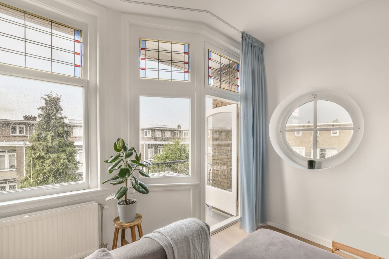 Exit to the balcony from the living room in white in a cozy house